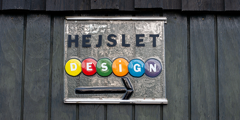 Hejslet Design logo i glas